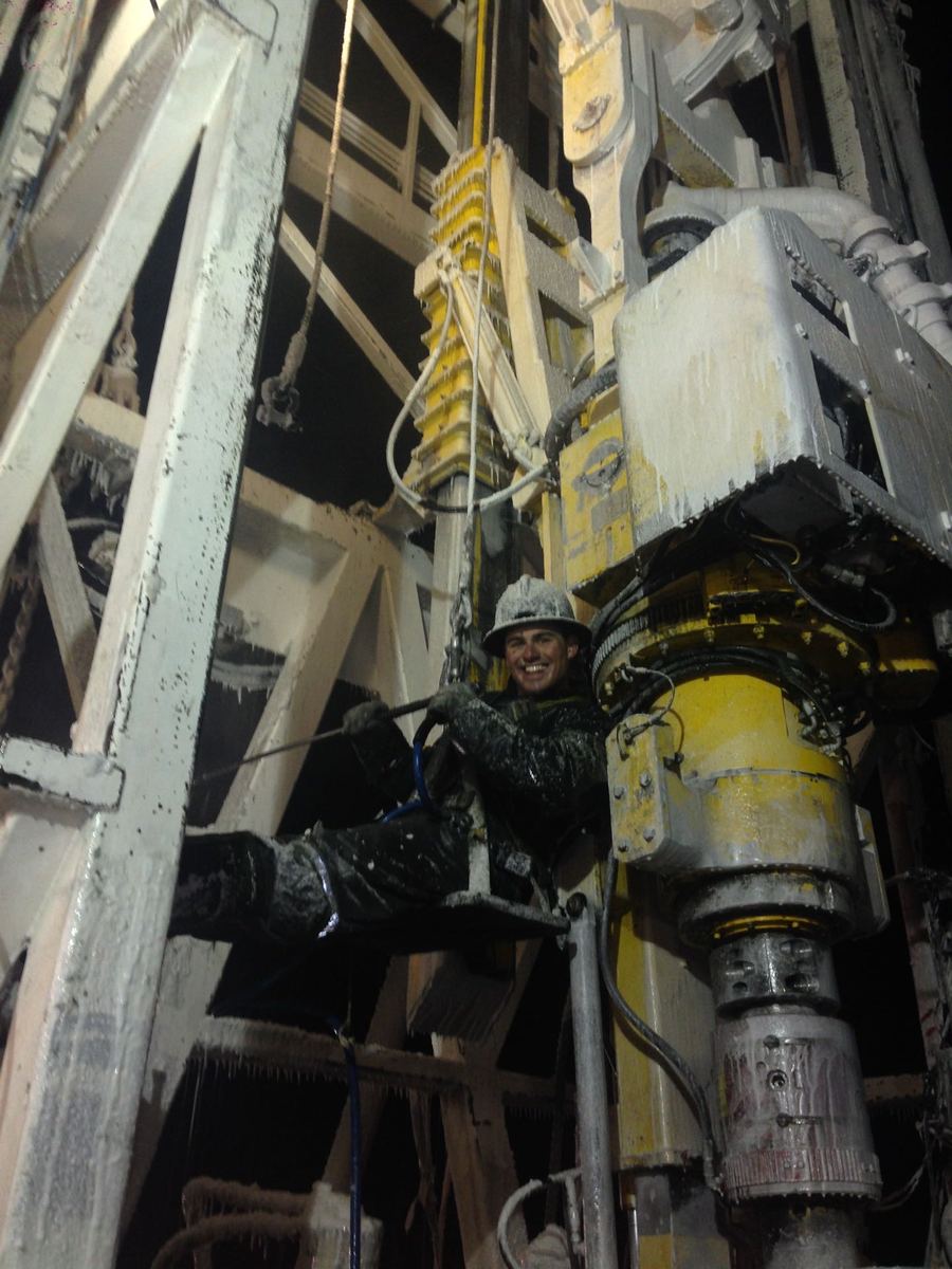 Derek Henderson working on an ice-covered rig at night